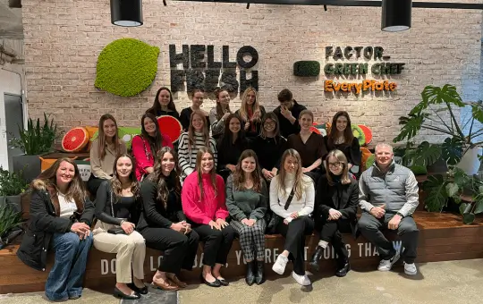 group of people sitting in an corporate office